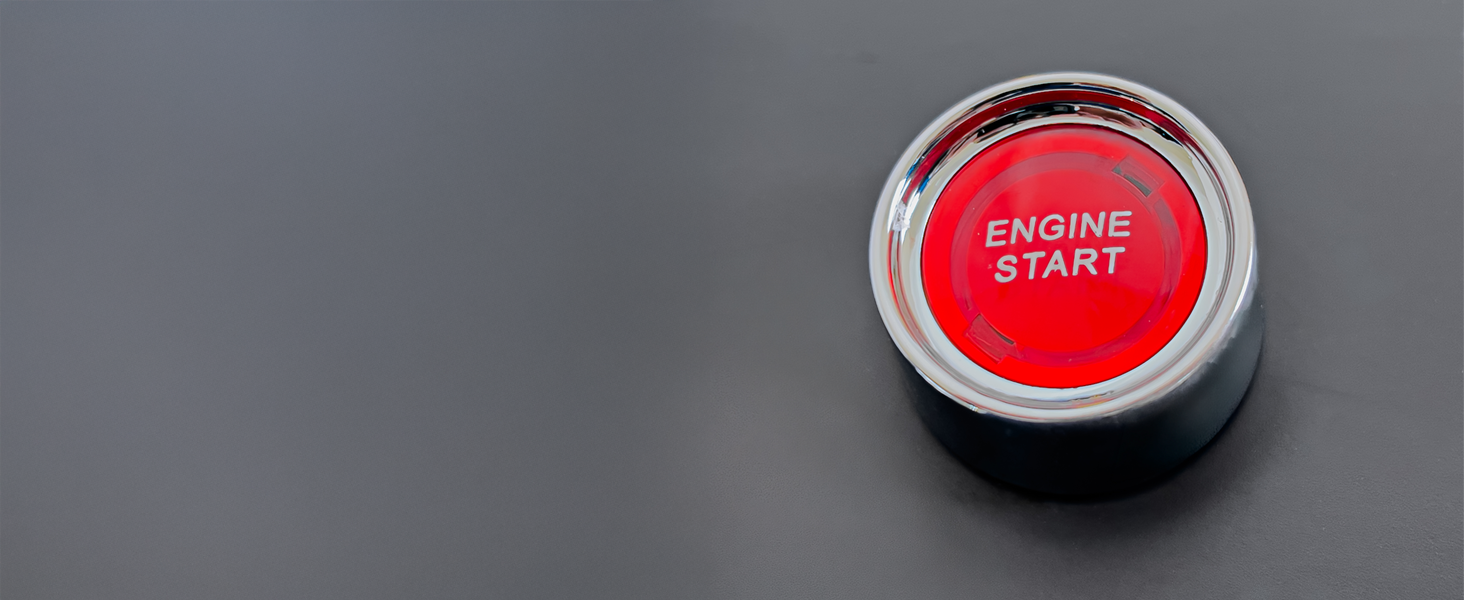 Gros plan d'un bouton rouge circulaire ou d'une interface de commande sur fond sombre, qui semble faire partie d'un dispositif ou d'un système électronique.