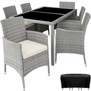 avec table en verre et six chaises. Tissu gris façon rotin avec coussins blancs. Comprend un pouf de rangement.