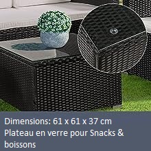 une table avec un plateau en verre et un vase dessus.