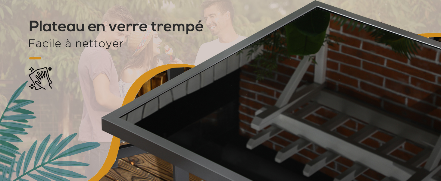 Gros plan d'un plateau ou d'un plateau en verre trempé. Le texte en français indique qu'il est facile à nettoyer. Vue partielle d'une structure en brique située à l'arrière.
