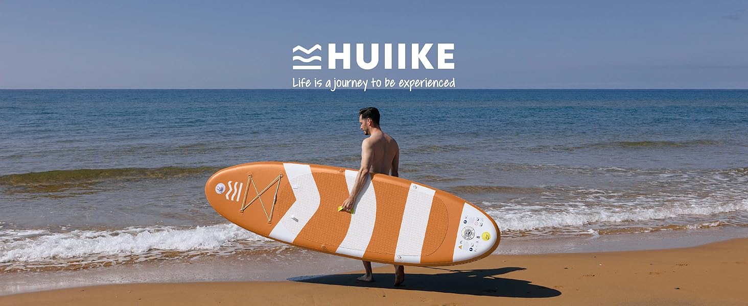 sur une plage de sable. L'océan et la personne sont visibles en arrière-plan. Logo « HUIKE » affiché en haut de l'