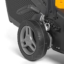 Collection of black and grey mechanical or industrial equipment components, featuring wheels and textured surfaces.