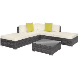 avec base tissée foncée, coussins crème, coussins décoratifs jaunes et table basse assortie