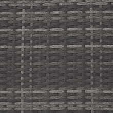 Gros plan d'une matière grise tissée avec un motif répétitif, peut-être une surface textile ou un meuble